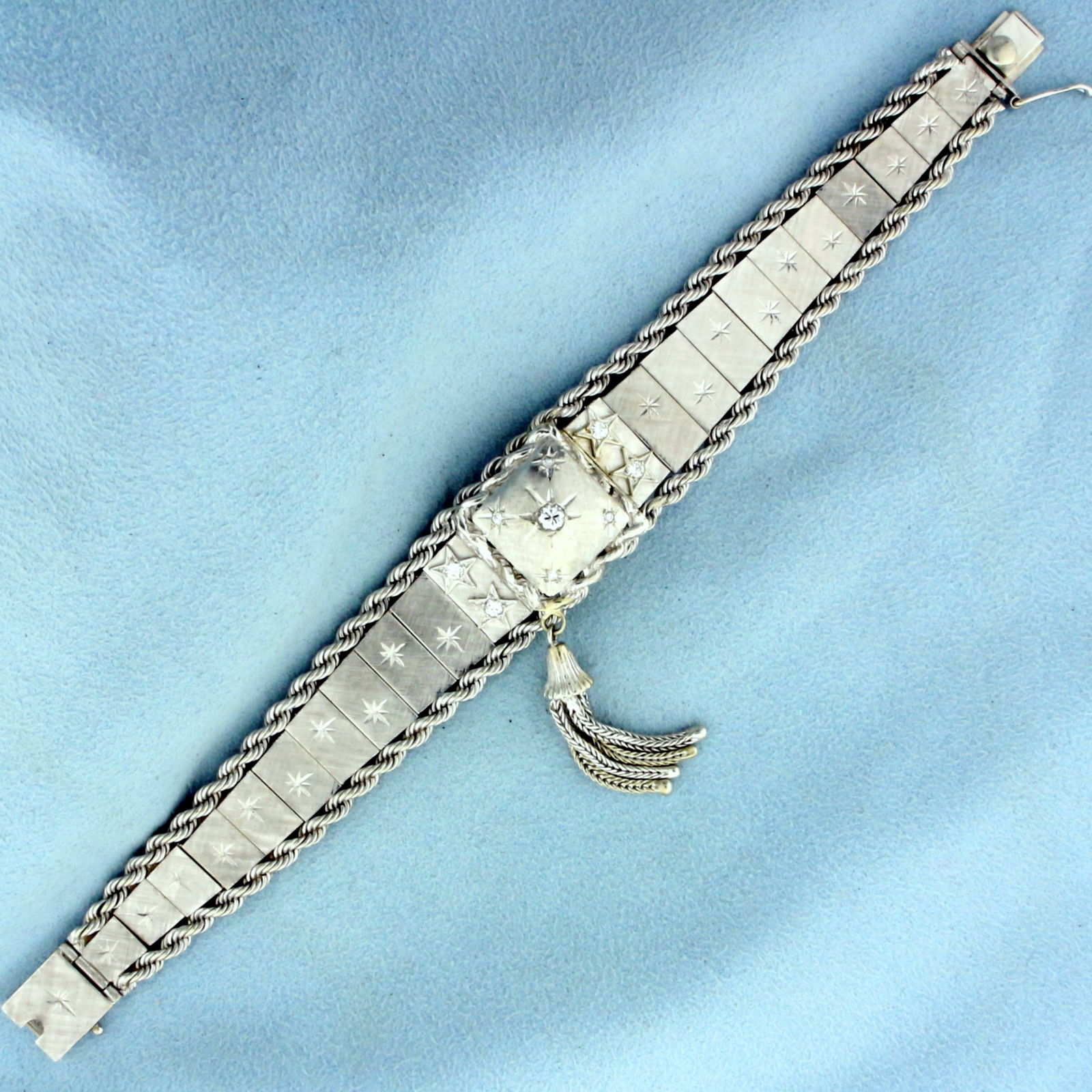 Vintage Diamond Windup Concealed Watch in 14K White Gold: Band and Case In Solid 14K White Gold. 17 Jewel Windup movement runs great. Contains one high quality .15ct, four .05ct, and four .01ct Diamonds, SI clarity/H color. 7 inches long. 20.5mm wide at cent