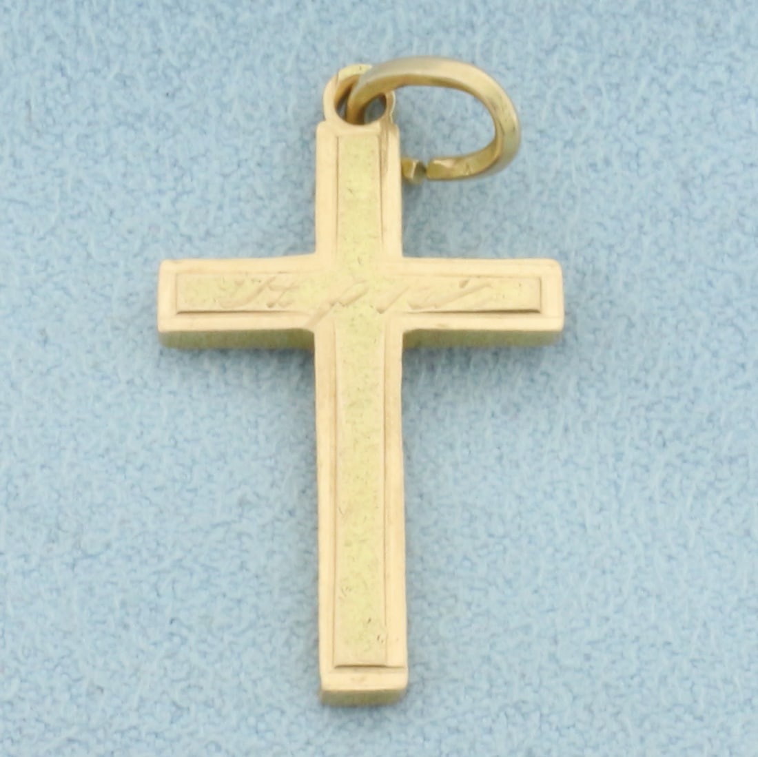 The Father Cross Charm in 14k Yellow Gold: In _14Yellow Gold. 1 inch long. 5/8 inch wide. Engraved on one side in Latin - The father. 2.5g.