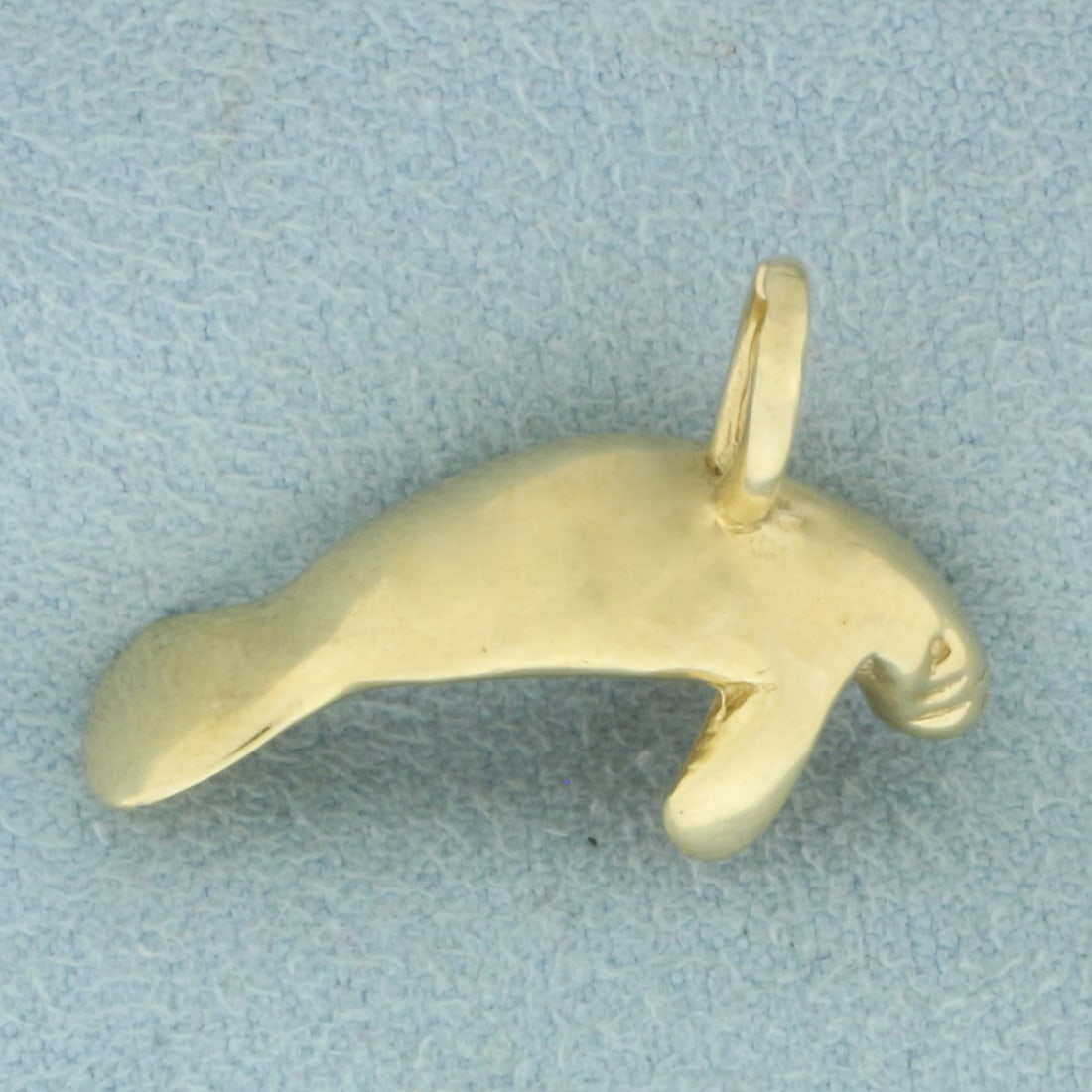 Manatee Pendant or Charm in _k Yellow Gold: In14_k Yellow Gold. 1 inch long. 3/4 inch wide. 4.1g.