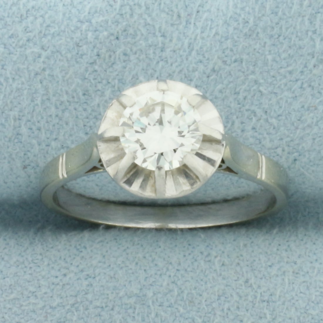 Diamond Solitaire Engagement Ring in 18k White Gold: In 18k White Gold. Contains one .85ct high quality diamond, VS clarity/H color. Mirrored setting to make diamond look like much larger 3ct diamond. 9mm wide at top of ring. Size 7. 3.5g.