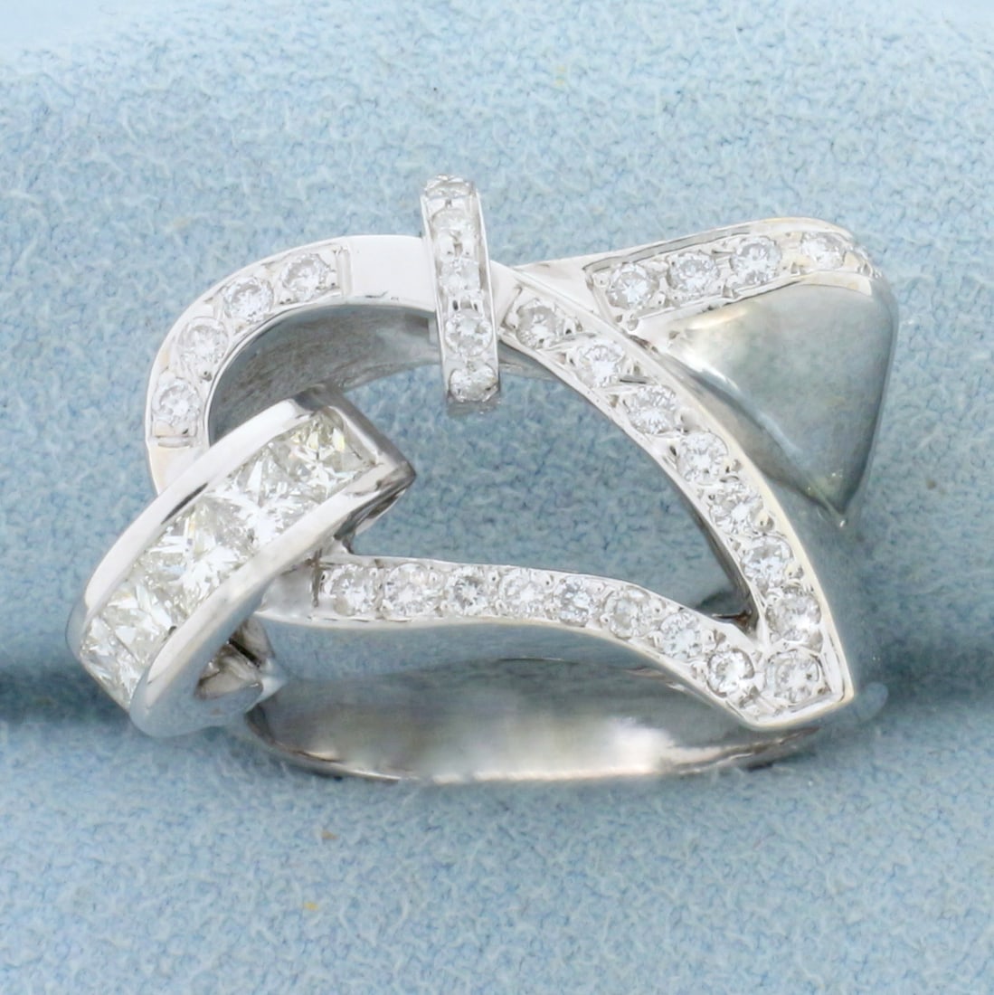 Diamond Abstract Modernist Design Ring In 18k White Gold: In 18k White Gold. Contains Seven High Quality .1ct Princess Cut Diamonds, SI clarity/I color. Also Thirty Three 0.01ct round Diamonds of similar high quality. Size 7. 11.9g