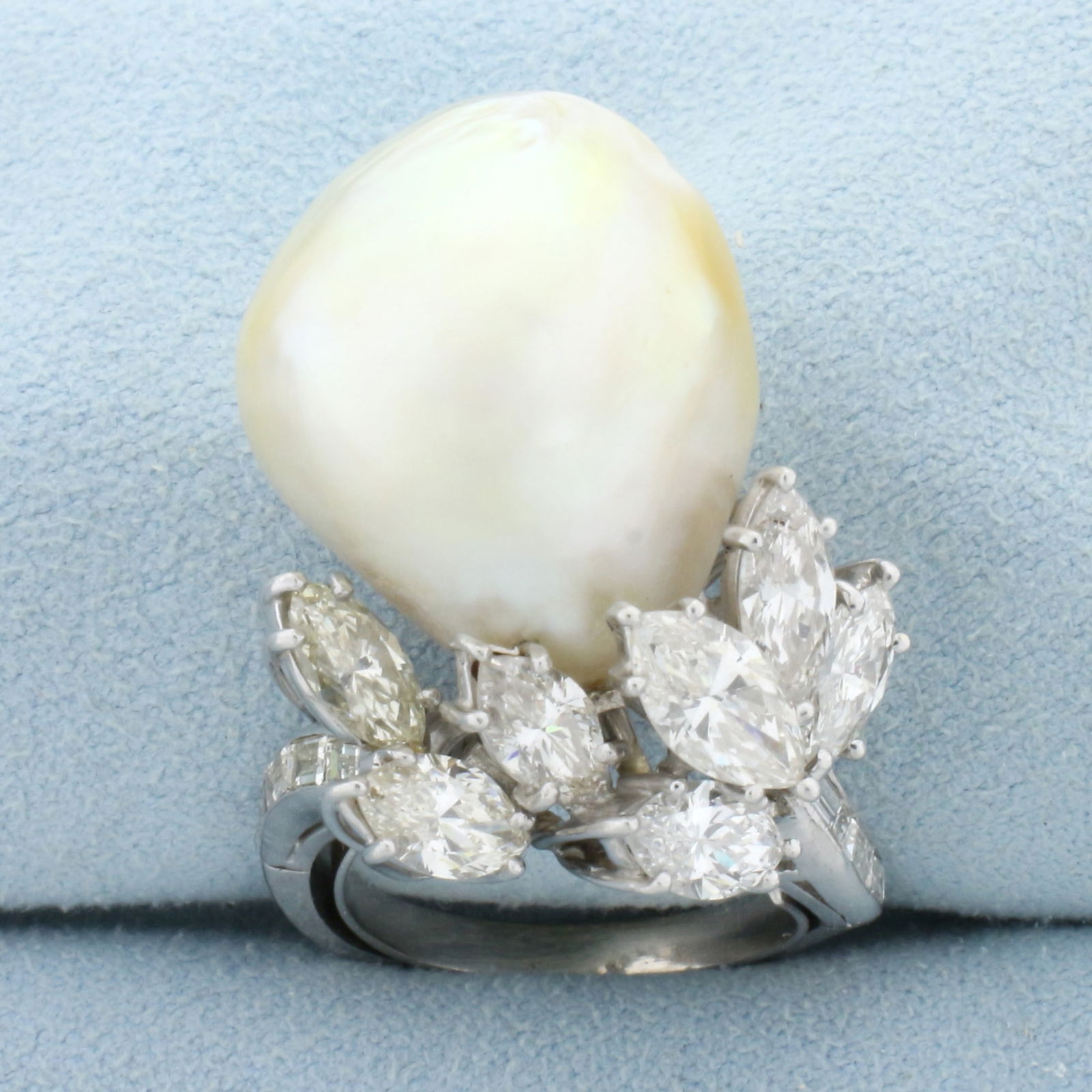 Designer One of A Kind Massive Pearl and Diamond Statement Ring in Platinum: In Platinum. Contains one high quality natural extremely large 20x17mm Baroque Pearl with excellent luster and iridescent undertone. Also contains seven high quality 8.5 x 4.5mm marquise cut and eight