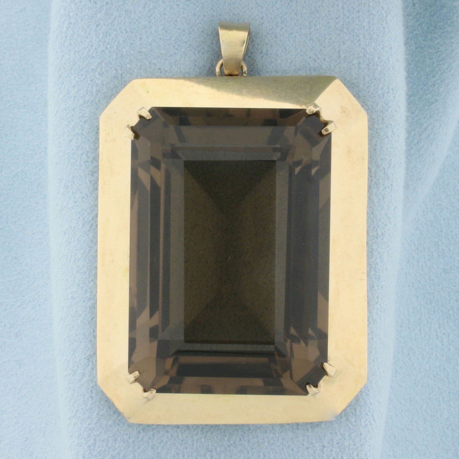 Huge 130ct Smokey Topaz Statement Pendant in 14k Yellow Gold: In 14k yellow gold. Contains one 35mmx25mm 130ct high quality natural smoky topaz gemstone with warm champagne color and excellent clarity. 2 inches long with bale. 32.3g.