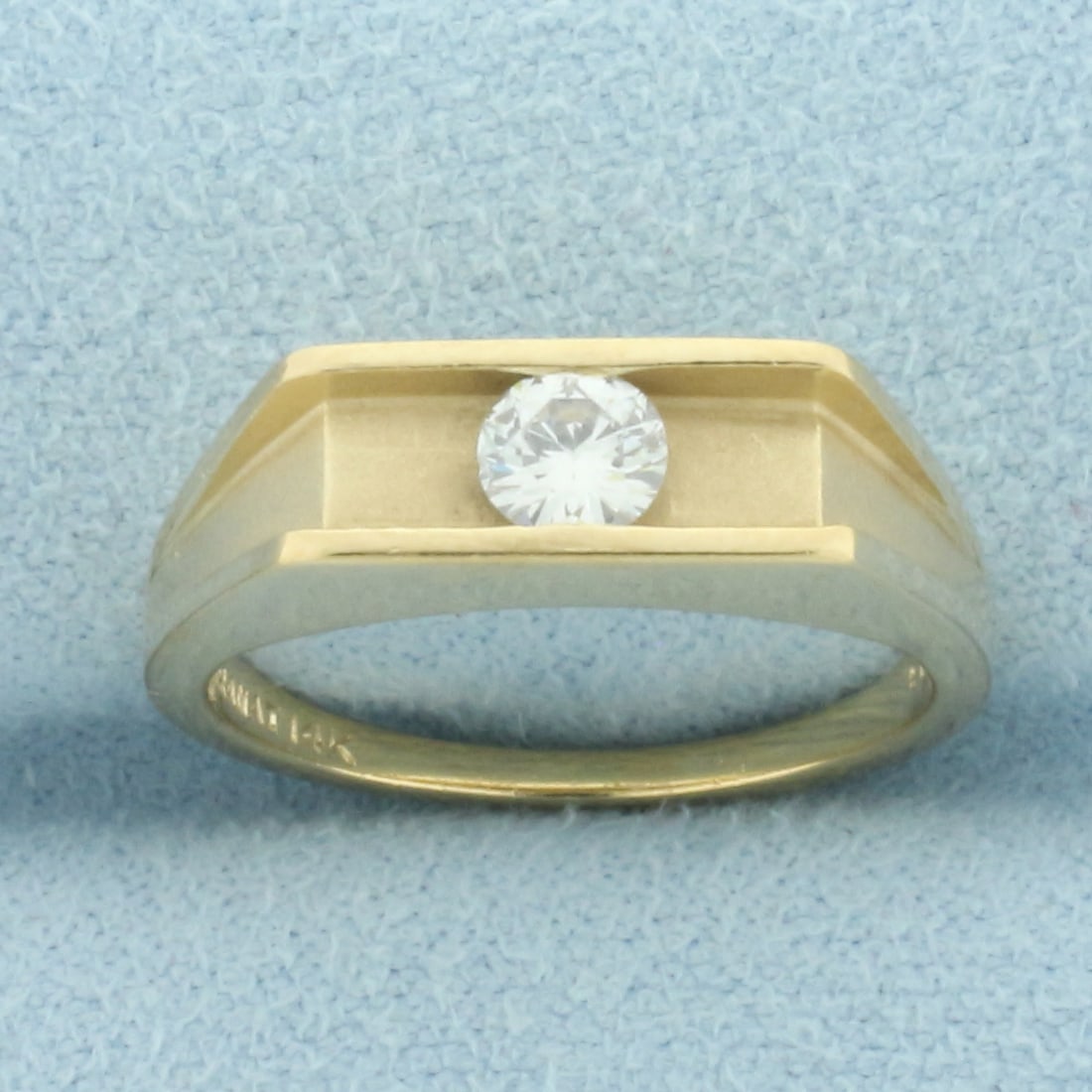 Tension Set Diamond Solitaire Ring in 14k Yellow Gold: In 14k yellow gold. Contains one high quality 1/4ct round brilliant diamond, VS clarity/G color, great cut for added brilliance. Matte and High polish finish details. 5.2mm wide at top. Size: 5. 3.6g.