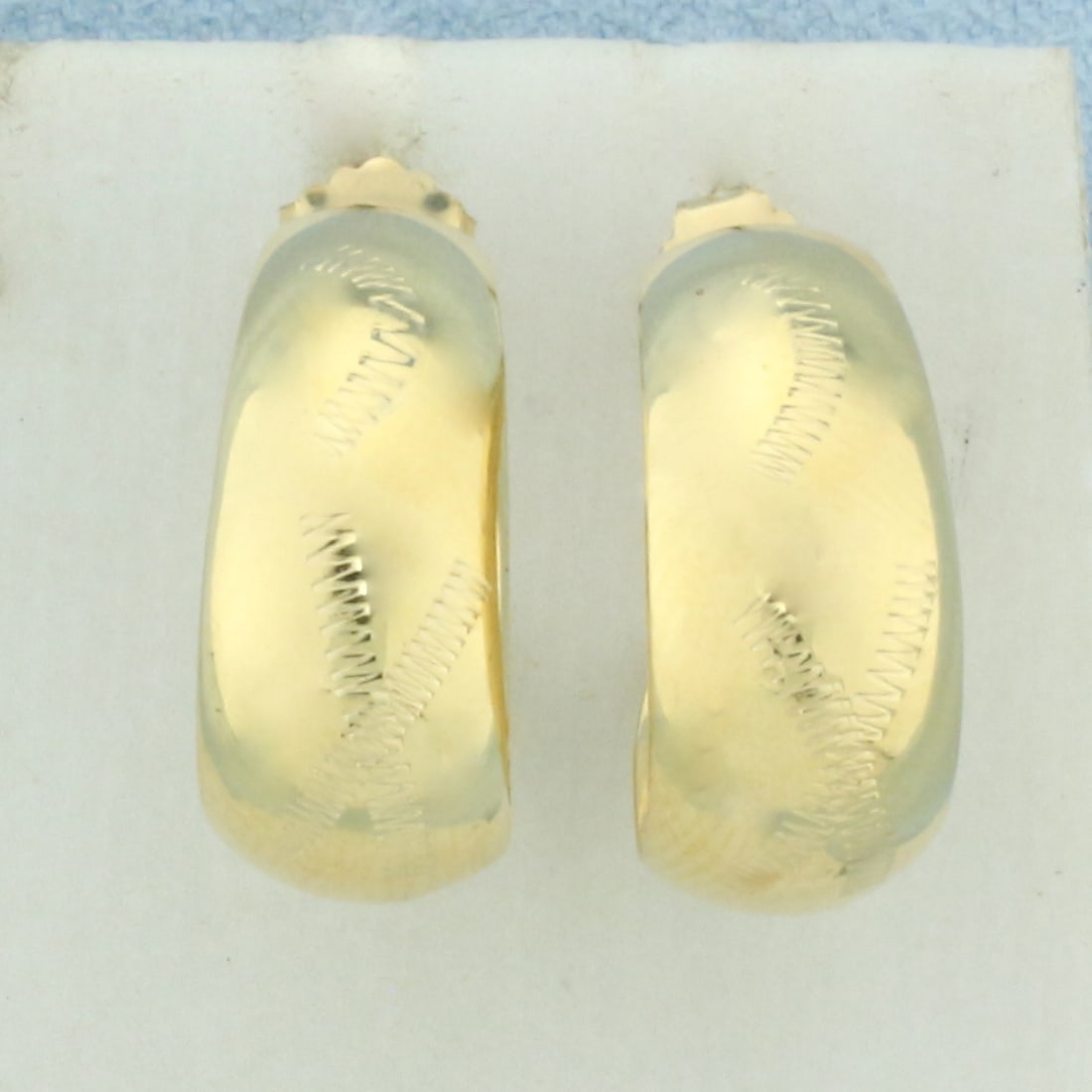 Etched Design Hoop Earrings in 14k Yellow Gold: In 14k yellow gold. 5/8 inch diameter, 8mm wide at widest point. New 10k yellow gold friction backs. 2.3g.