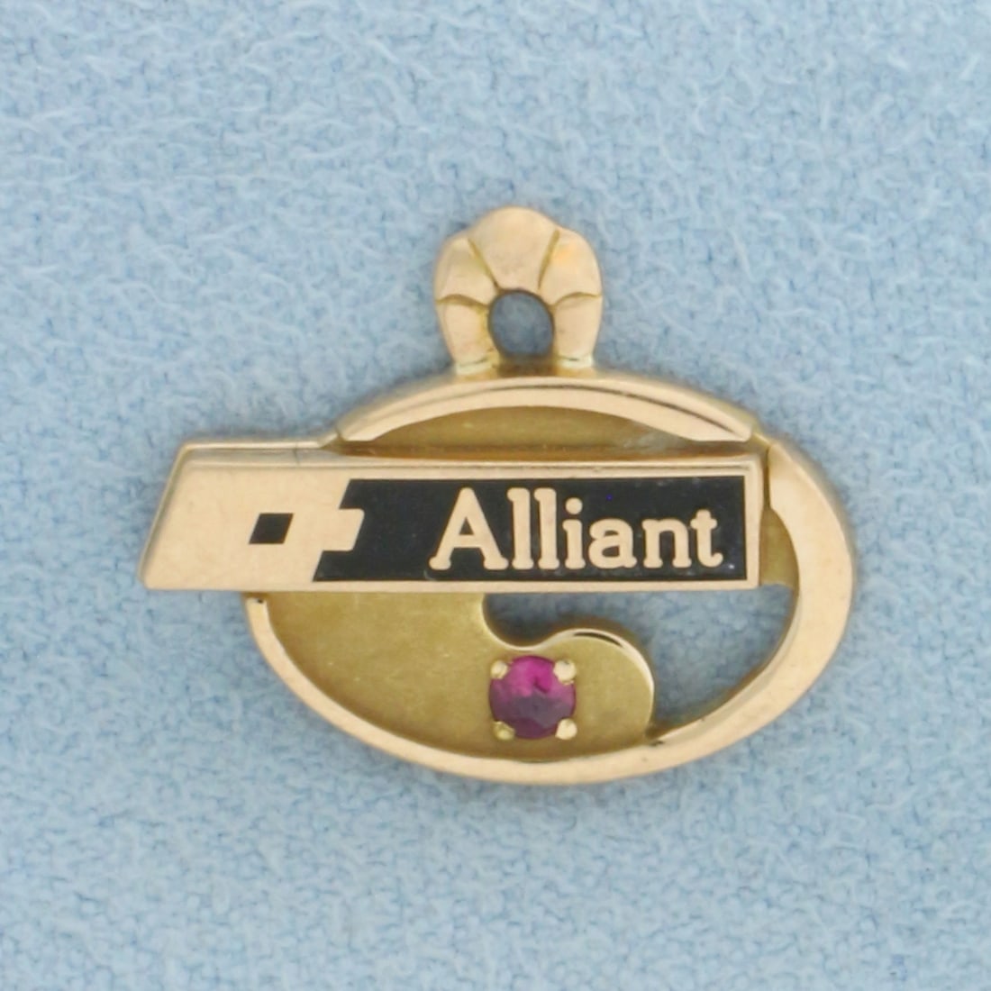 Vintage Alliant Ruby Charm in 10k Yellow Gold: In 10k Yellow Gold. Contains one high quality natural 2mm ruby. 1/2 inch long. 5/8 inch wide. 2.1g.