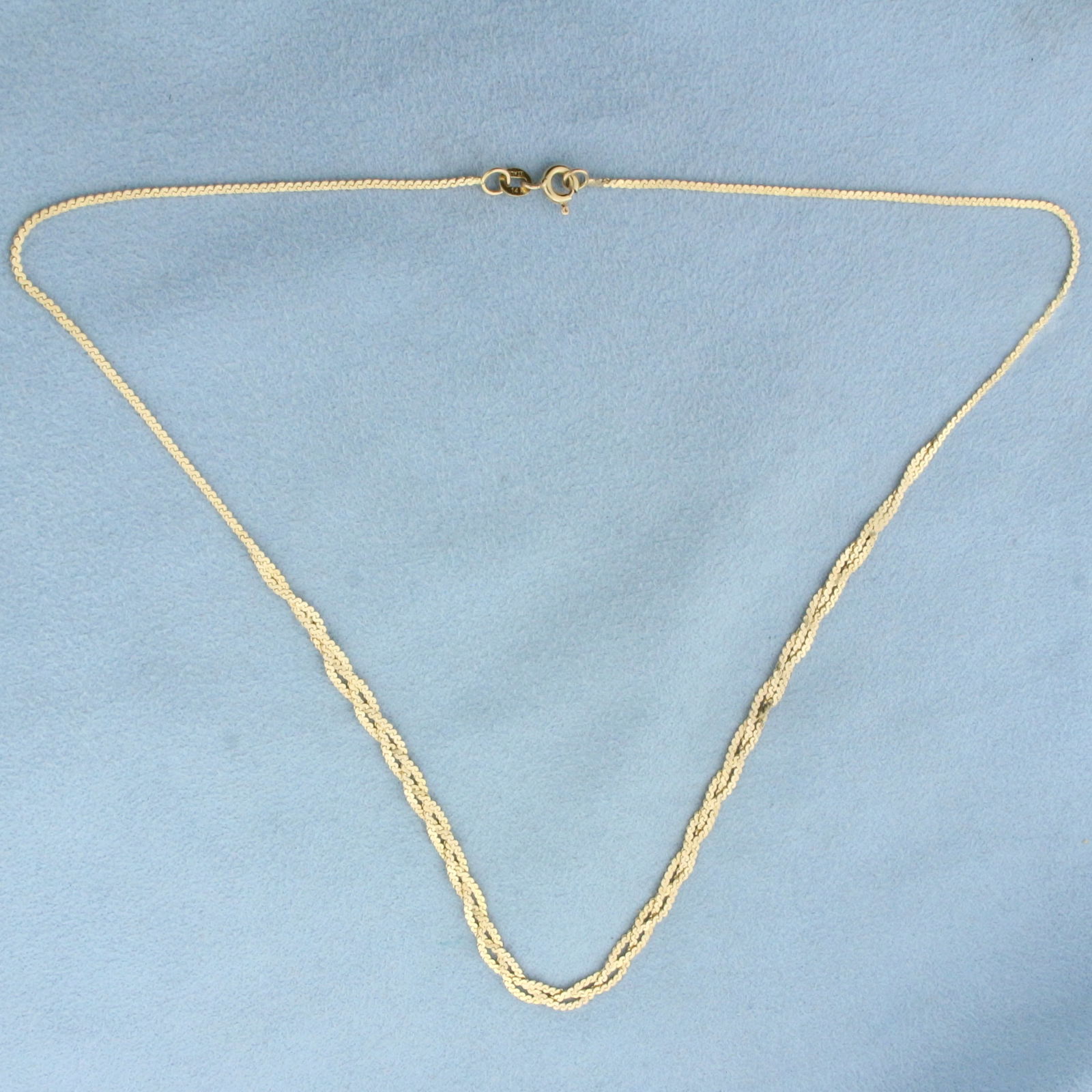 16 Inch Italian Braided S-Link Serpentine Chain Choker Necklace in 14k Yellow Gold: In 14k Yellow Gold. 16 inches long. 1.2mm thick chain. Italian made. Spring clasp. 4.1g.
