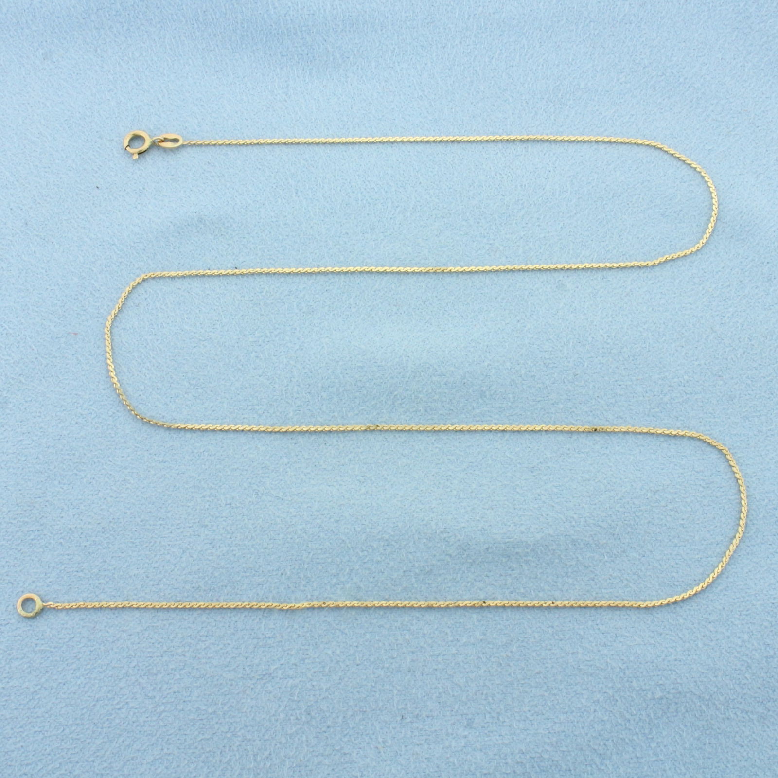 16 Inch Italian S-Link Chain Link Necklace in 14k Yellow Gold: In 14k Yellow Gold. 16 inches long. 0.8mm wide. Made in Italy. Spring clasp. 1.0g.