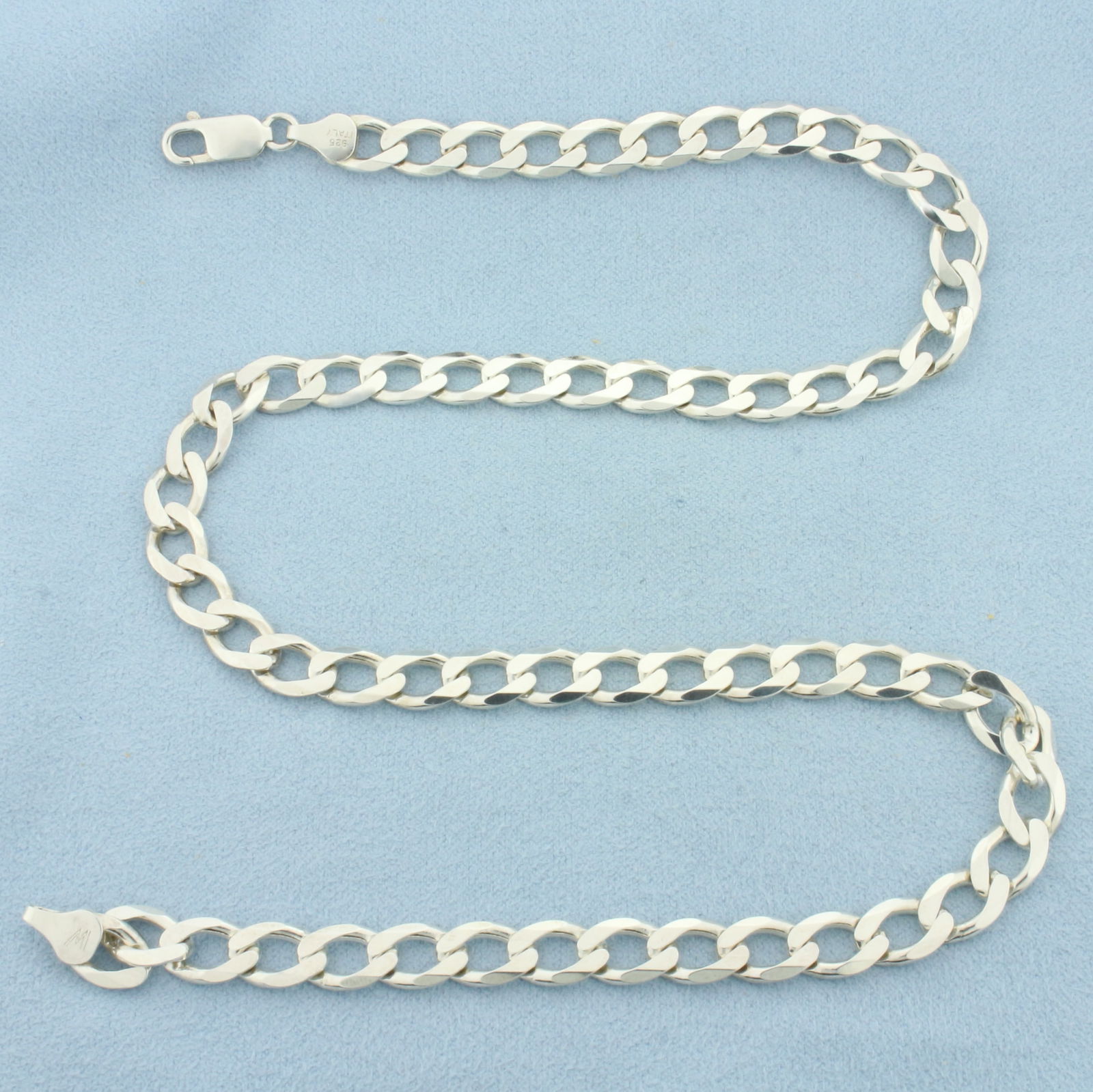 Italian 18 Inch Curb Link Chain Necklace In Sterling Silver: In .925 Sterling Silver. 18 inches long. 7mm wide. Italian made. Lobster clasp. 27.1g.