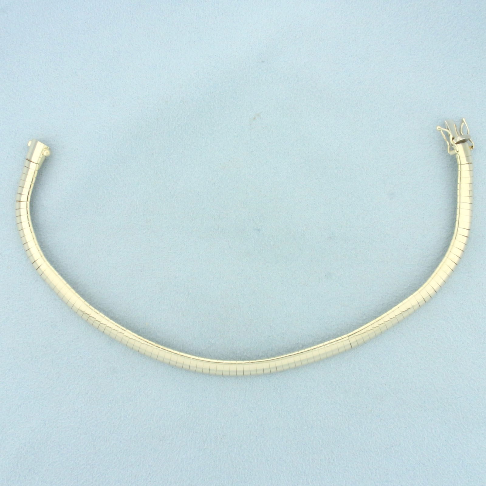 Italian Omega Link Bracelet in 14k Yellow Gold: In 14k yellow gold. Italian made. 8.5 inches long x 6.2mm wide. Concealed slide clasp with double safety latch. 18.4g.