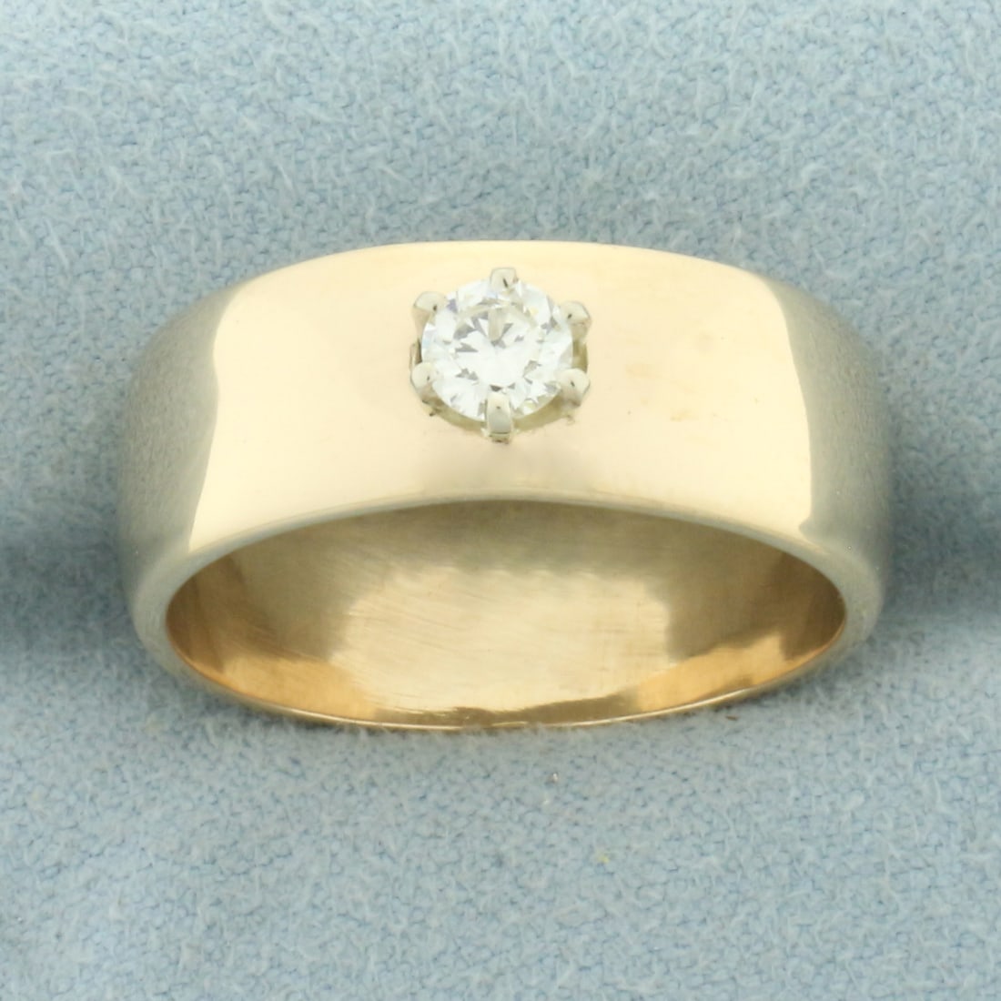 Wide Band Diamond Ring in 14k Yellow Gold: In 14k yellow gold. Contains one high quality 1/3ct round brilliant diamond, VS clarity/H color. 8.5mm wide. Size: 10.5. 9.4g.