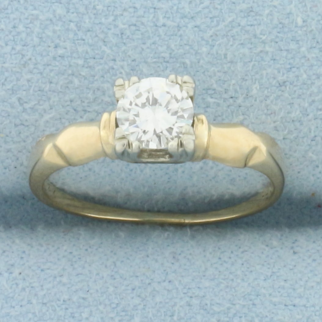 Vintage Diamond Solitaire Engagement Ring in 14k Yellow Gold: In 14k Yellow Gold. Contains one high quality 1/2ct diamond, SI1 clarity/G color, great cut for added brilliance. Hand engraved inside, can be removed upon request. Size 5.5. 2.0g