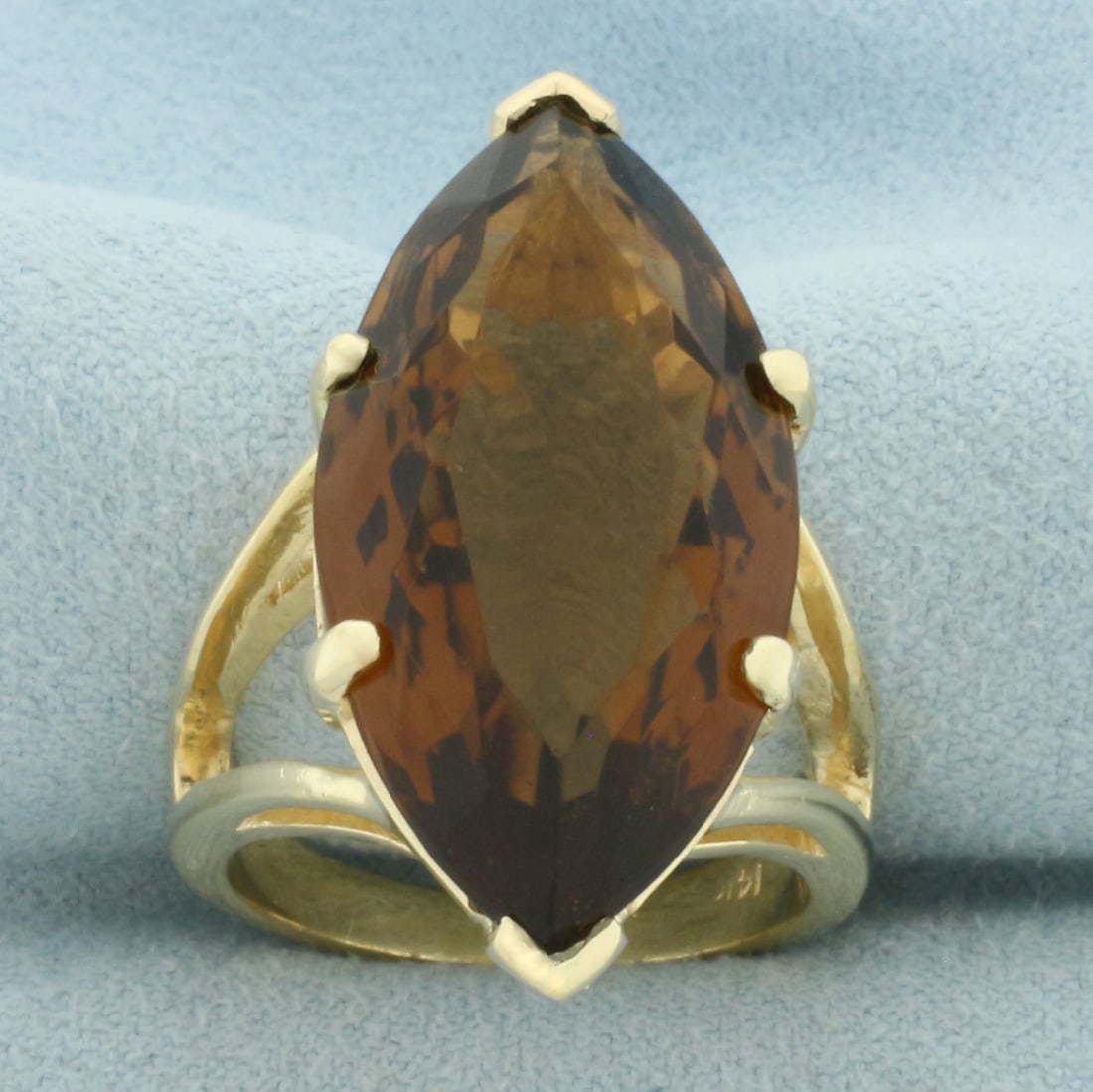 Large Marquise Smoky Topaz Solitaire Statement Ring in 14k Yellow Gold: In 14k Yellow Gold. Contains one 31x15mm high quality marquise cut natural Smoky Quartz gemstone, approximately 22cts, with intense color and excellent clarity. Size 9.5. 14.7g.