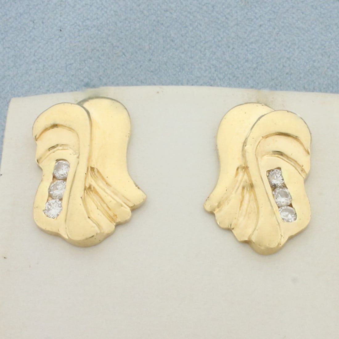 Unique Abstract Design Diamond Earrings in 14k Yellow Gold: In 14k Yellow Gold. Contains six high quality diamonds, 1/3ct TW, SI clarity/H color. 3/4 inch long. 1/2 inch wide. Friction backs. 6.2g.