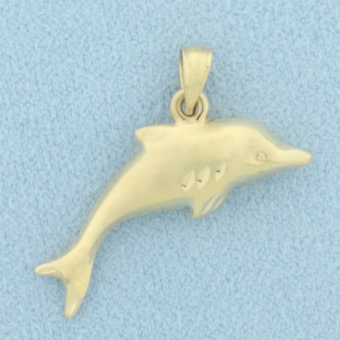3D Dolphin Pendant in 14k Yellow Gold: In 14k Yellow Gold. 1/2 inch long. 1 inch wide. 0.9g.