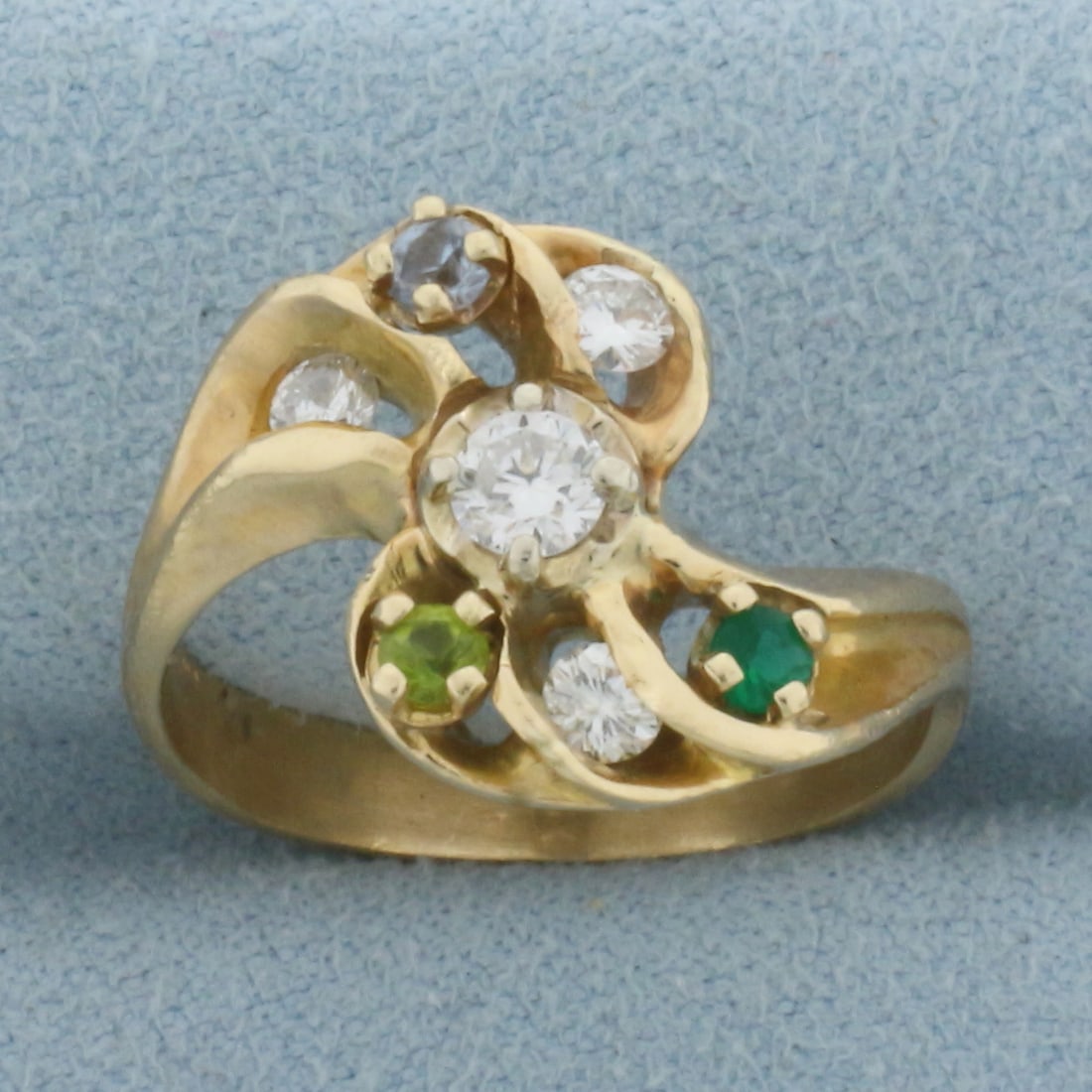 Pinwheel Diamond and Gemstone Ring in 14K Yellow Gold: In 14K Yellow Gold. Contains one .2ct and two .1ct diamonds, SI clarity/G color. Also contains a high quality natural .1ct blue topaz, citrine, and green topaz gemstone, all with bright color and exce