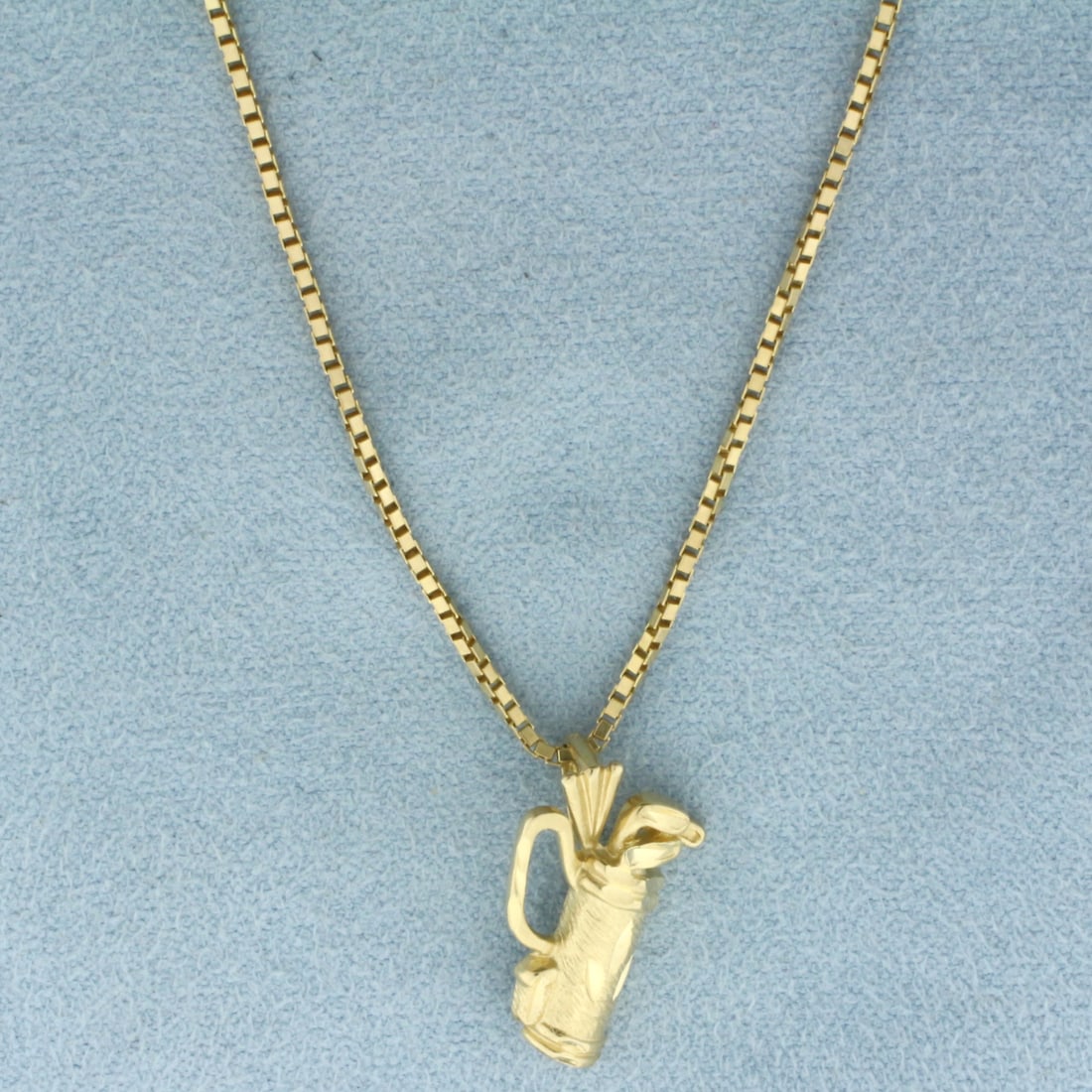 Italian Golf Clubs Necklace in 14K Yellow Gold: In 14k yellow gold. Italian made box link chain, 16 5/8 inches long by 1.1mm wide. Pendant is 3/4 inches long by 1/2 inch wide. 5.2g.