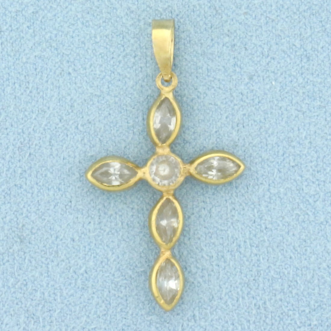 CZ Cross Pendant in 14k Yellow Gold: In 14k Yellow Gold. Contains four 6mmmarquise and one 4mm round high quality CZ gemstones with excellent clarity and color. 1 1/4 inch long including bale. 3/4 inch wide. 1.3g.
