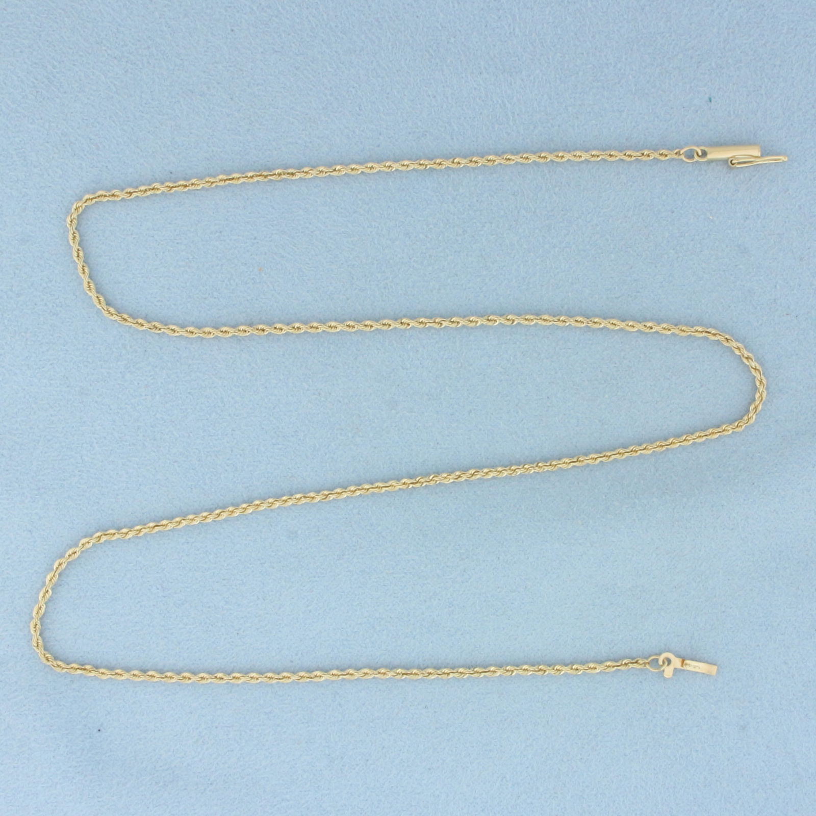 18 Inch Rope Link Chain Necklace in 14k Yellow Gold: In 14k Yellow Gold. 18 inches long. 1.5mm wide. Barrel clasp with safety latch. 4.2g.