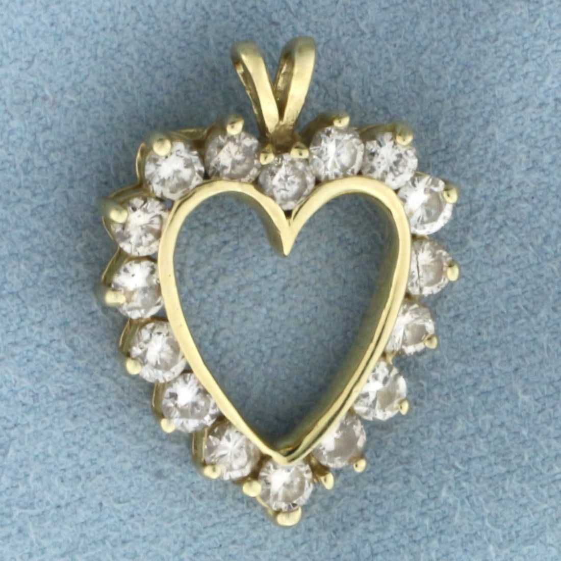 Diamond Heart Pendant in 14k Yellow Gold: In 14k Yellow Gold. Contains sixteen 1/8ct high quality diamonds, 2ct TW, SI clarity/H color. 1 inch long. 3/4 inch wide. 3.6g.