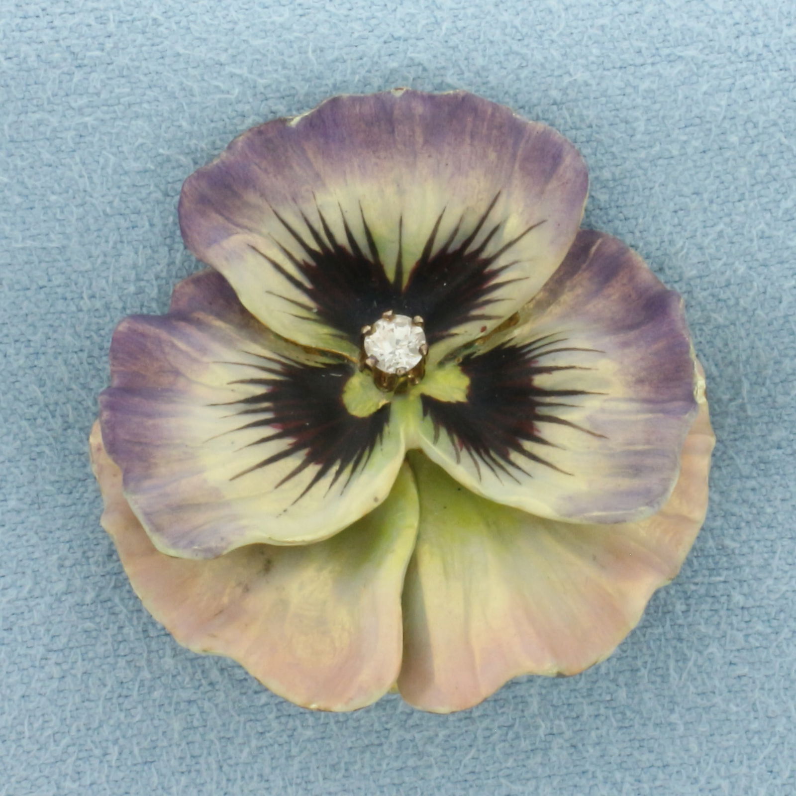 Antique Art Nouveau Enameled Diamond Pansy Pendant or Brooch in 14k Yellow Gold: In 14k yellow gold. Measures 1 1/8 inch long x 1 1/8 inch wide. Contains one high quality Old European cut diamonds, 1/10ct, H color/I clarity. Can be worn as pin/brooch or as a pendant by swinging th