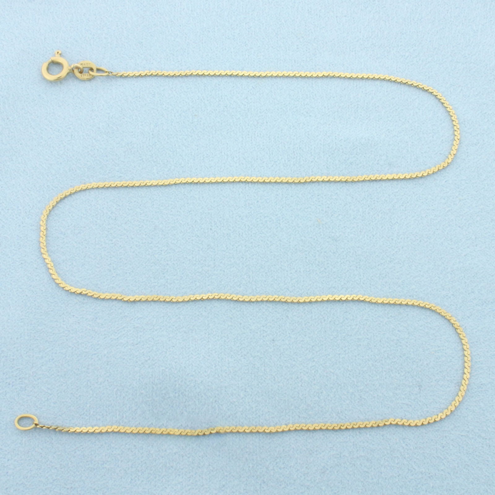 15 Inch Italian S-Link Chain Necklace in 14k Yellow Gold: In 14k Yellow Gold. 15 inches long. 1.2mm wide. Made in Italy. Spring clasp. 2.3g.