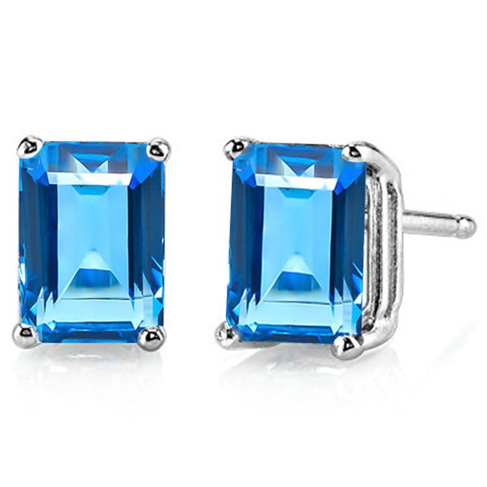 7x5MM Emerald Cut London Blue Topaz 2CTW Stud Earrings in Sterling Silver: In platinum over .925 sterling silver basket mountings with friction backs included. Contains 2 emerald cut London blue topaz gemstones with excellent color and clarity, approx. 2CTW, 7x5mm each. 1.5g