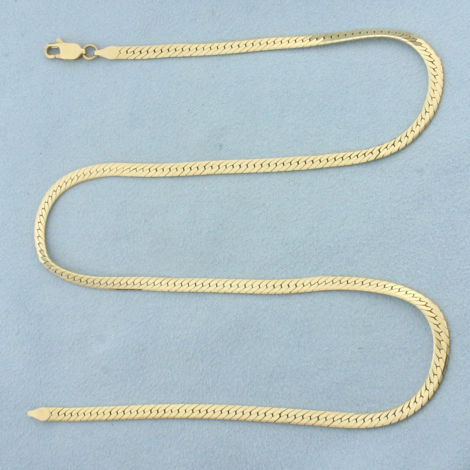 19 Inch Herringbone Link Chain Necklace in 14k Yellow Gold: In 14k Yellow Gold. 19 inch long. 3.5mm wide. Lobster clasp. 11.2g.