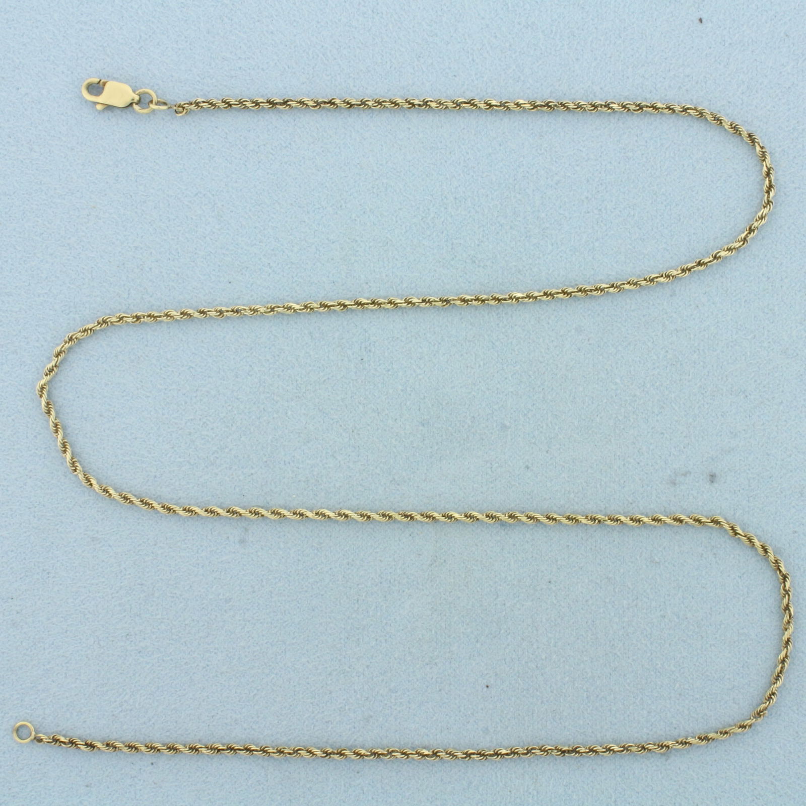 18 Inch Rope Link Chain Necklace in 14k Yellow Gold: In 14k Yellow Gold. 18 inches long. 1.5mm wide. Lobster clasp. 4.1g.