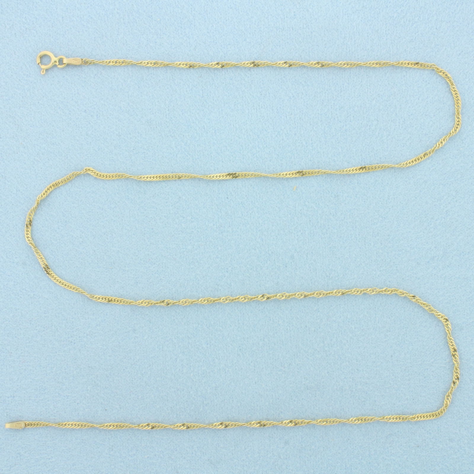 18 Inch Italian Twisting Curb Link Chain Necklace in 14k Yellow Gold: In 14k Yellow Gold. 18 inches long. 1.6mm wide. Made in Italy. Spring clasp. 2.2g.