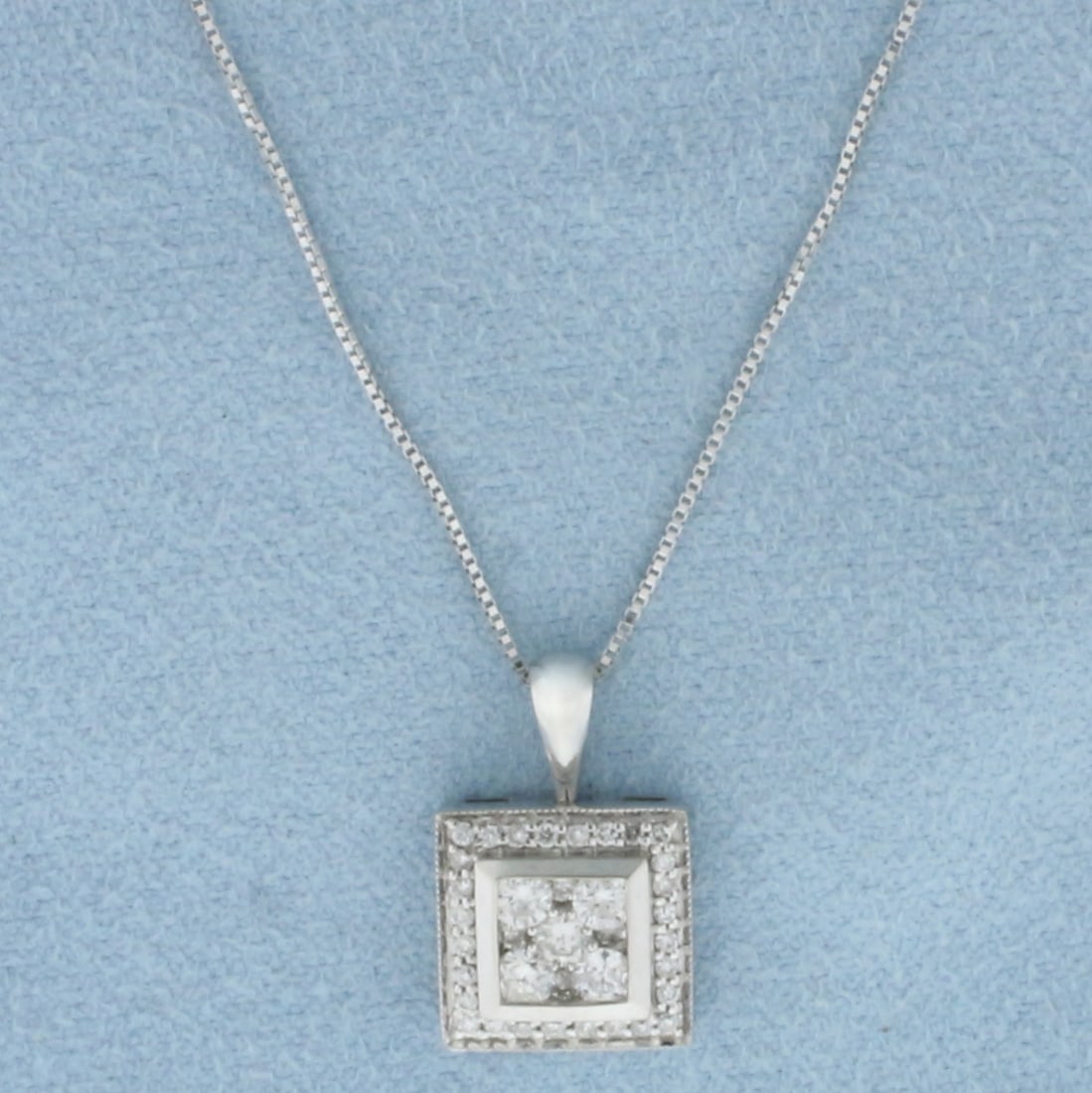 Diamond Necklace in 14k White Gold: In 14k White Gold. Pendant contains 37 high quality diamonds, 1/2ct TW, H color/SI clarity. 5/8 inch by 3/8 inch pendant. Box link chain is 18 inches long, 0.5mm wide. Spring clasp. 3.1g.