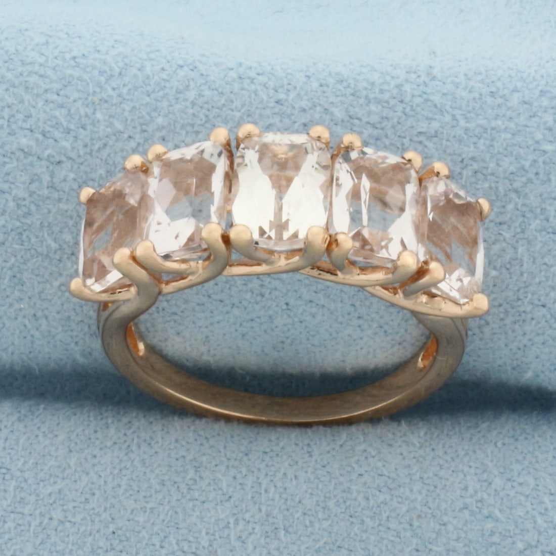 Morganite 5-Stone Ring in 10k Rose Gold: In 10k Rose Gold. Contains five 7.4x5.3mm high quality radiant cut Morganite gemstones with excellent clarity. Size 7.5. 4.2g.