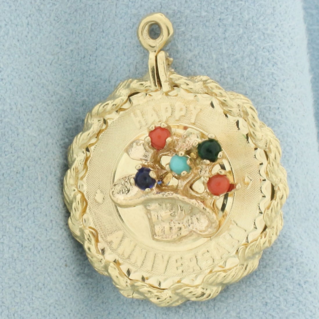 Happy Anniversary Gem Pendant in 14k Yellow Gold: In 14k yellow gold. 1 1/8 inches long and 7/8 inches wide. Contains 5 gems 2mm high quality cabochon gemstones including turquoise, sapphire, emerald, and carnelian. 4.0g.