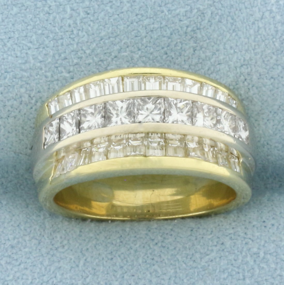 Princess and Emerald Cut Diamond Band Ring In 18k Yellow Gold: In 18k Yellow Gold. Contains nine princess cut and twenty four emerald cut high quality diamonds, 2ct TW, VS clarity/H color . 10mm wide at center. Size 5.5. 10.3g.