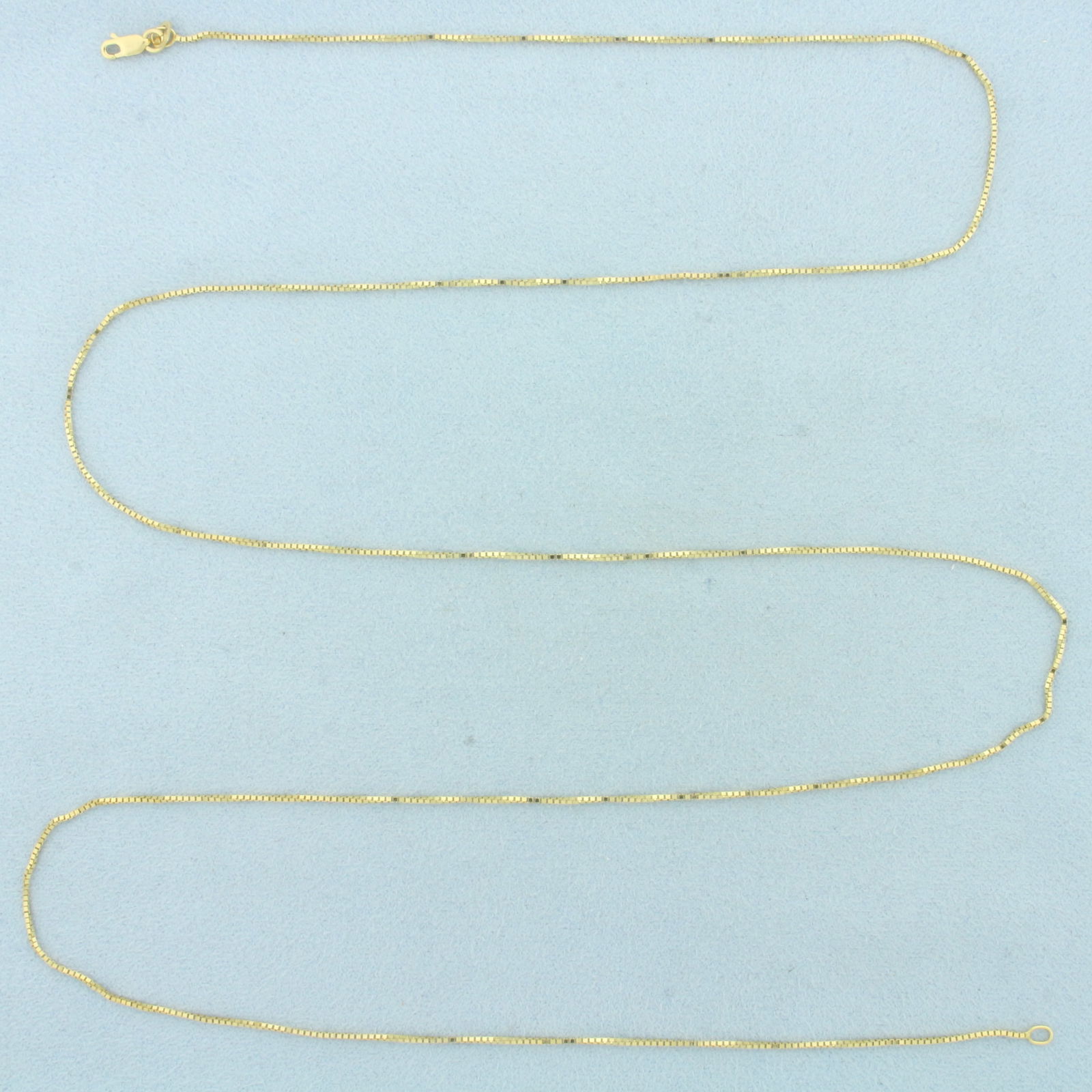 Italian 30 Inch Box Link Chain Necklace in 14k Yellow Gold: In 14k Yellow Gold. 29 inches long. 1mm wide. Box link. Made in Italy. Lobster clasp. 3.4g.