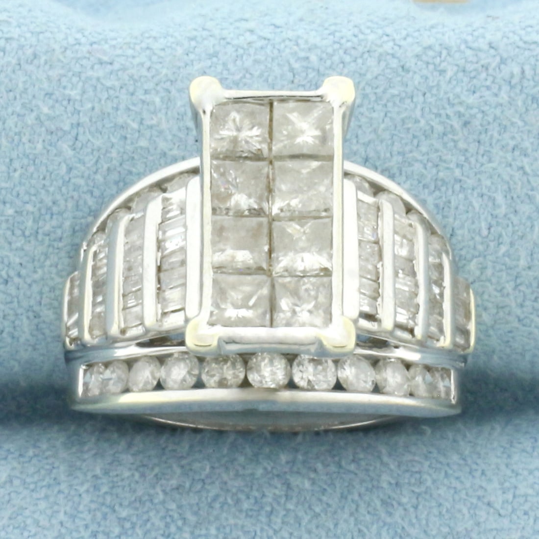 Modern Design Diamond Ring in 10k White Gold: In 10k White Gold. Contains eight princess cut, twenty two round, and forty baguette high quality diamonds, 2ct TW, H color/I clarity. 14mm wide at widest. Size 6.25. 7.6g.