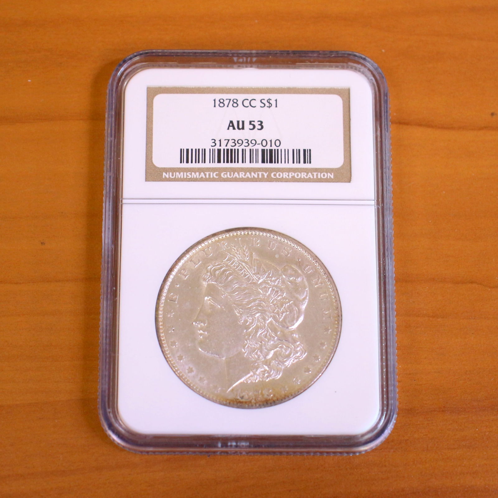 1878 NCG AU53 Carson City Morgan Silver Dollar Coin: One coin from 1878 .Graded by Numismatic Guaranty Corporation, NGC.