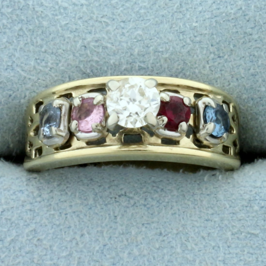 Vintage Diamond, Ruby, Sapphire, and Topaz Ring in 10K Yellow Gold: In 10K Yellow Gold. Contains one high quality natural .4ct diamond, SI2 clarity/H color, eye clean, with great cut for lots of sparkle. Also contains a 3mm high quality natural Ruby, Sapphire, Pink Sa