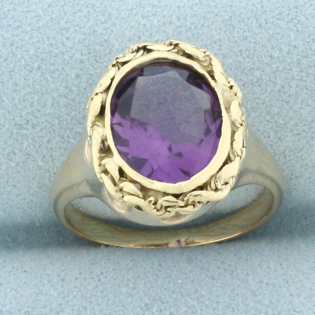 Vintage Amethyst Rope Bezel Ring in 14k Yellow Gold: In 14k yellow gold. Contains one high quality natural 12x9mm Amethyst gemstone with intense color and excellent clarity. Size: 6.25. 5.0g.