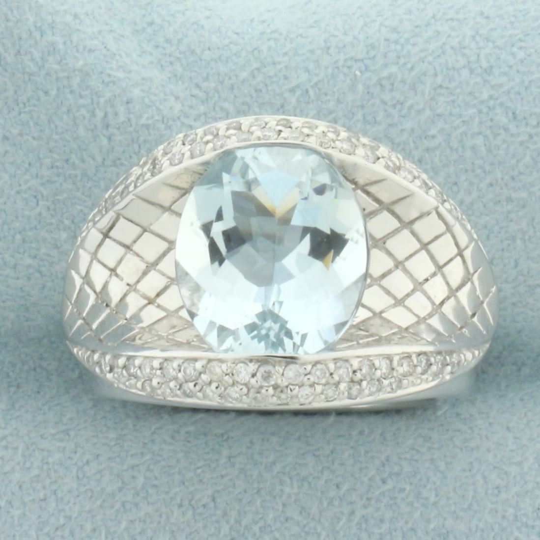 4ct Aquamarine and Diamond Quilted Design Ring in 14k White Gold: In 14k white gold. Contains 1 high quality natural 4ct oval Aquamarine gemstone, 12.5mm x 10.2mm, with bright color and excellent clarity. Also contains 60 high quality 1/2pt diamonds. 16mm wide at to