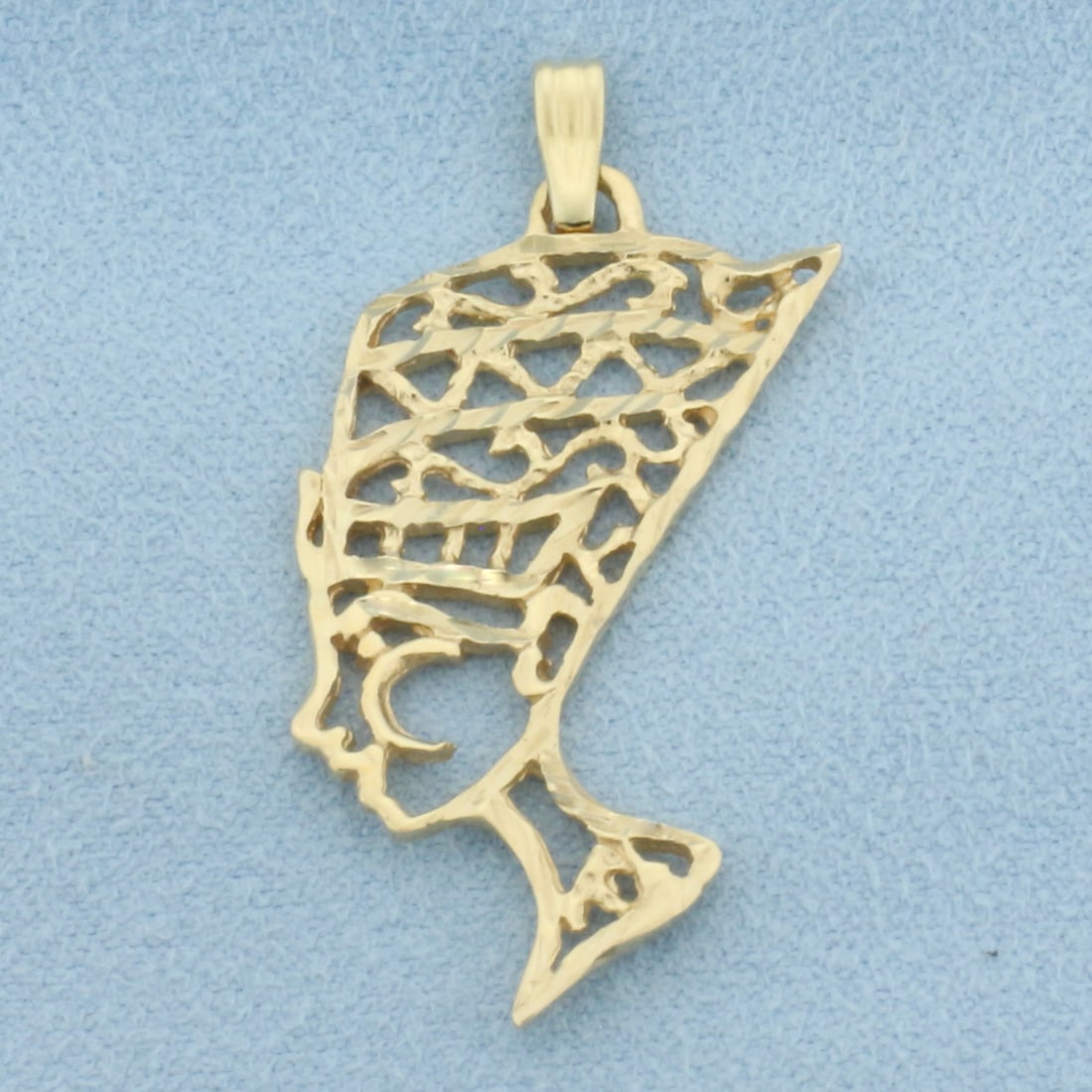 Nefertiti Cutout Pendant in 14k Yellow Gold: In _k Yellow Gold. 1 5/8 inch long (including bale). 7/8 inch wide. Diamond cut for added brilliance. 2.7g.