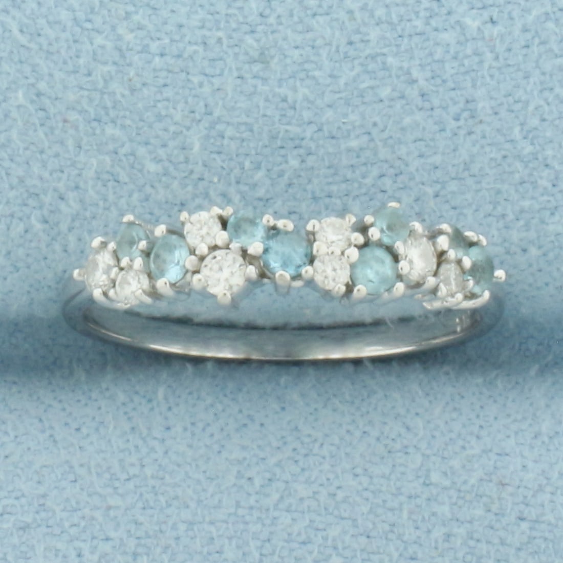 Aquamarine and Diamond Ring in 14k White Gold: In 14k White Gold. Contains four 2mm and four 1.5mm high quality natural Aquamarine gemstones with intense color and excellent clarity. Also contains three .03ct and five .01ct high quality diamonds,
