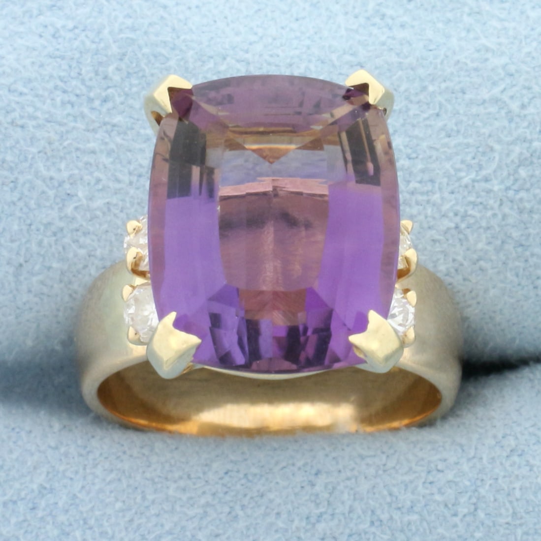 12ct Amethyst and Diamond Statement Ring in 14k Yellow Gold: In 14k yellow gold. Contains one huge 12ct high quality natural Amethyst gemstone with intense color and excellent clarity. Also contains four 1/5ct diamonds, SI clarity/G color. Size 9. 11.5g.