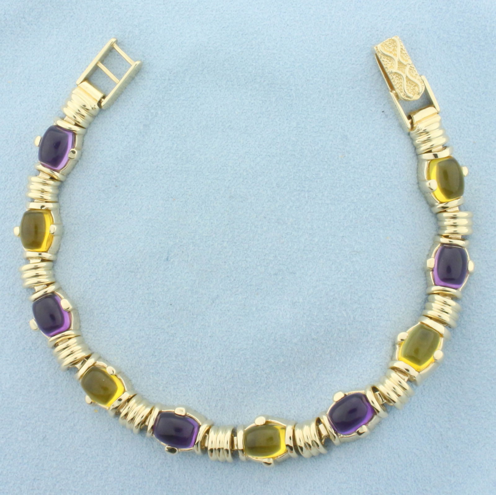 Heavy Amethyst and Citrine Bracelet in 14k Yellow Gold: In 14k Yellow Gold. Contains five 6x9mm high quality natural Citrine gemstones, approximately 10ct TW, with vibrant color and excellent clarity. Also contains five 6x9mm high quality natural Amethyst