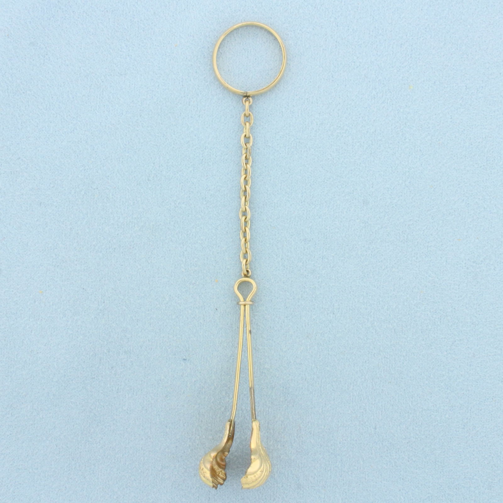 Antique Gold Plated Sugar Tongs on Chain: Gold Plated. 14 1/4 inches long. 5/8 inch wide. 4.6g.
