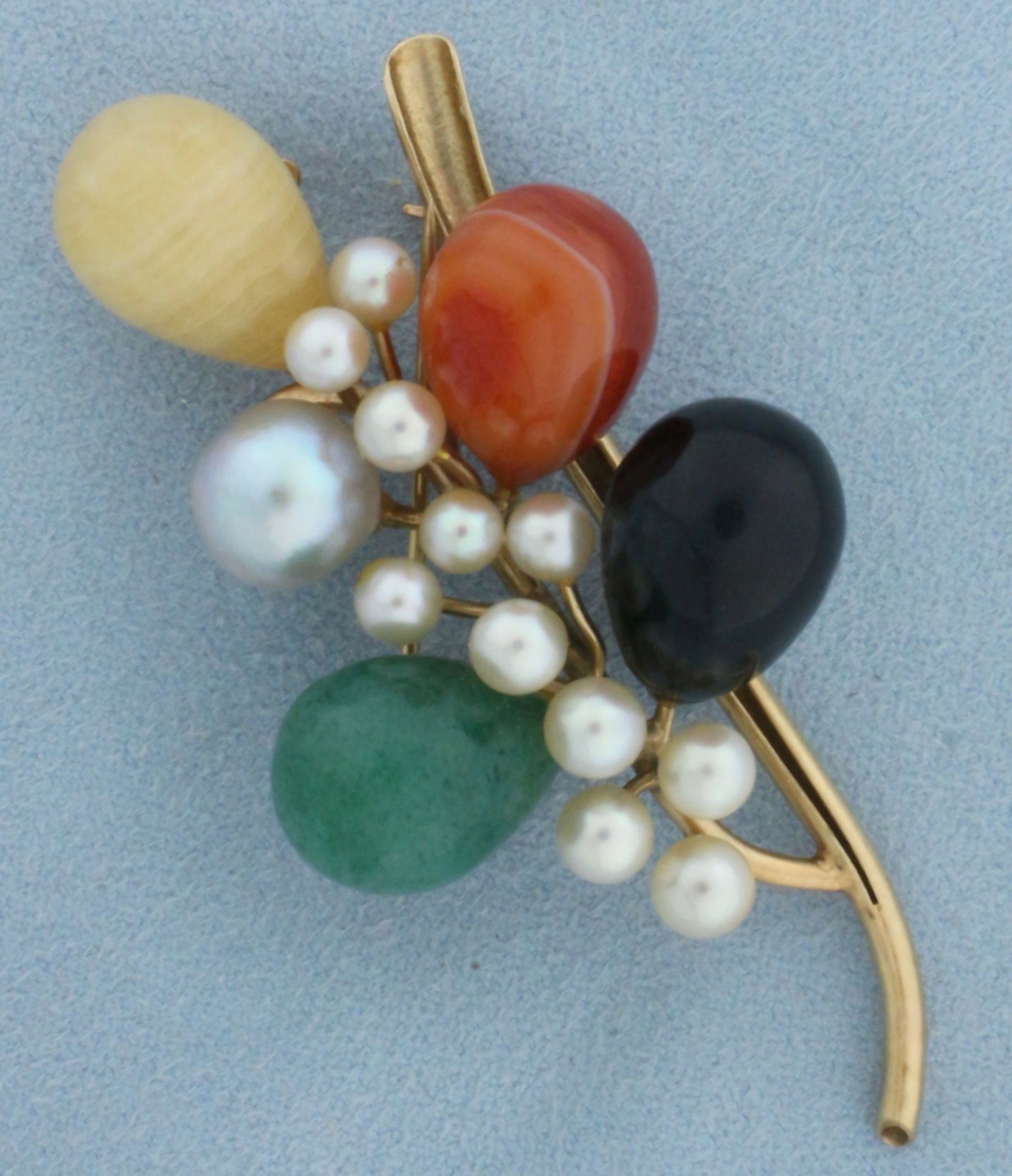Designer Ming's Jade and Pearl Brooch Pin in 14k Yellow Gold: In 14k yellow gold. Created by designer Ming's. Contains 15mm high quality jade, jasper, onyx, and calcite gemstones. Also contains one high quality 9mm Akoya pearl with beautiful silver color and