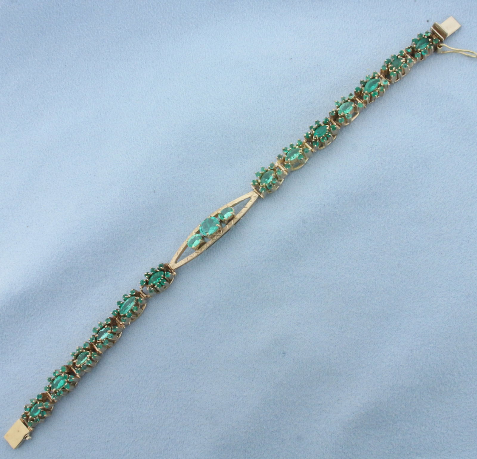 Vintage 7ct Tsavorite Bracelet in 18k Yellow Gold: In 18k yellow gold. Contains 7cts of high quality natural Tsavorite gemstones with beautiful emerald green color and excellent clarity. 7 inches long, 8mm wide in middle. Slide clasp with safety