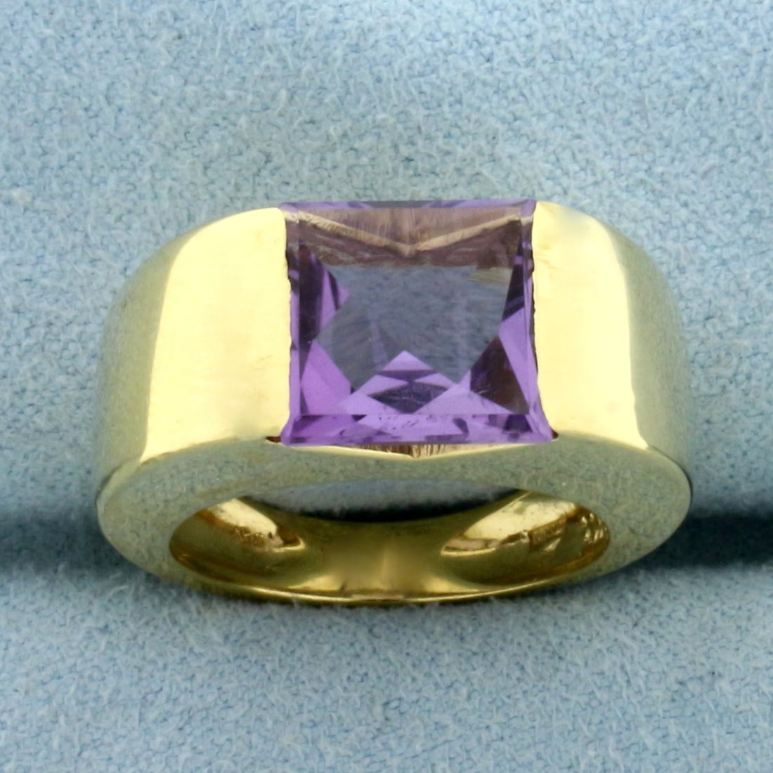 Italian Designer Modern Amethyst Ring in 18k Yellow Gold: In 18k Yellow Gold. Contains one 10mm high quality fancy square cut natural Amethyst gemstone with vibrant color and excellent clarity. Amethyst set flush into ring for unique look. 9.7mm wide at wide