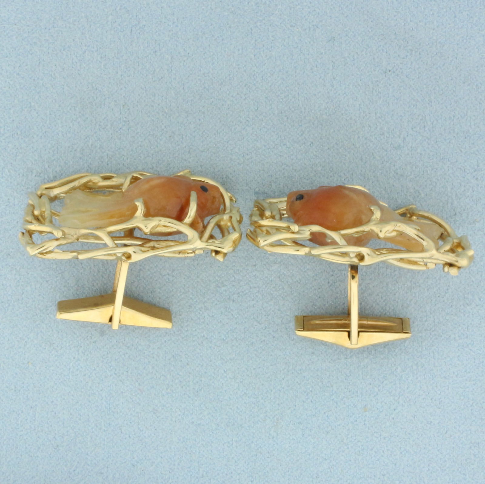 Carved Jade Fish Cufflinks in 14k Yellow Gold: In 14k Yellow Gold. Contains two 24mm high quality hand carved natural Jade gemstones. 1 1/4 inch long. 7/8 inch wide. 23.2g.