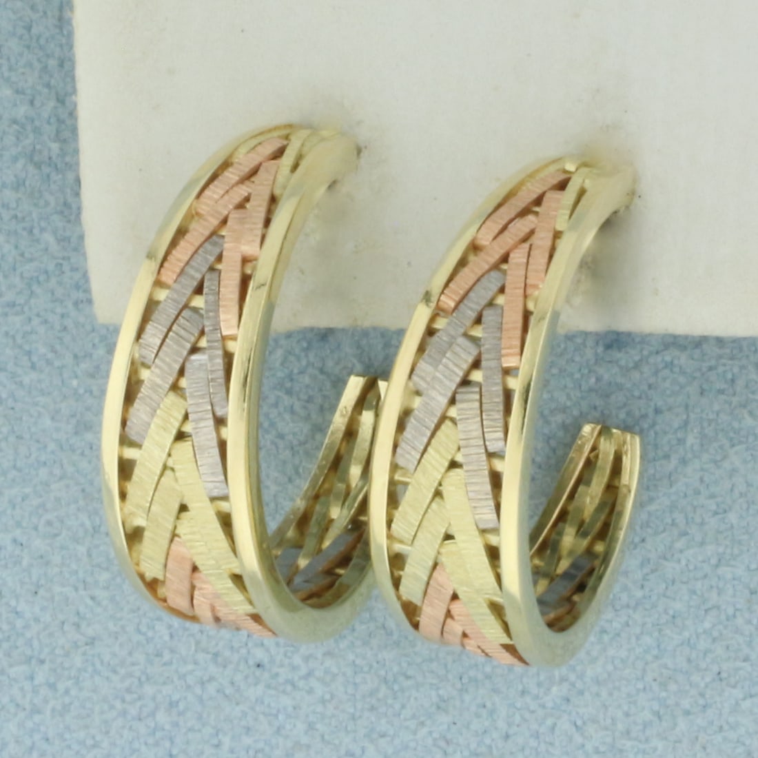 Tri-Color Hoop Earrings in 14k Yellow, Rose, and White Gold: In 14k Yellow, Rose, and White Gold. 3/4 inch long. 6.3mm wide at widest. Friction backs. 5.6g.